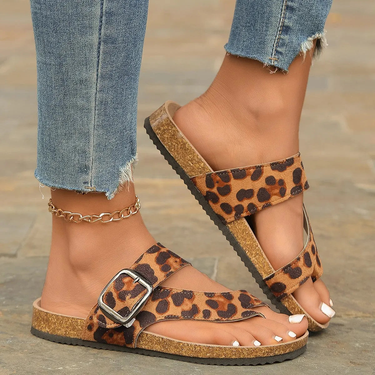 Leopard print Roman style slippers with covering toe and wooden sole.