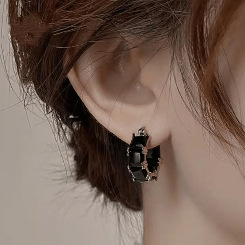 Geometric U-shaped copper earrings with round crystal zirconium accents in gold electroplated finish