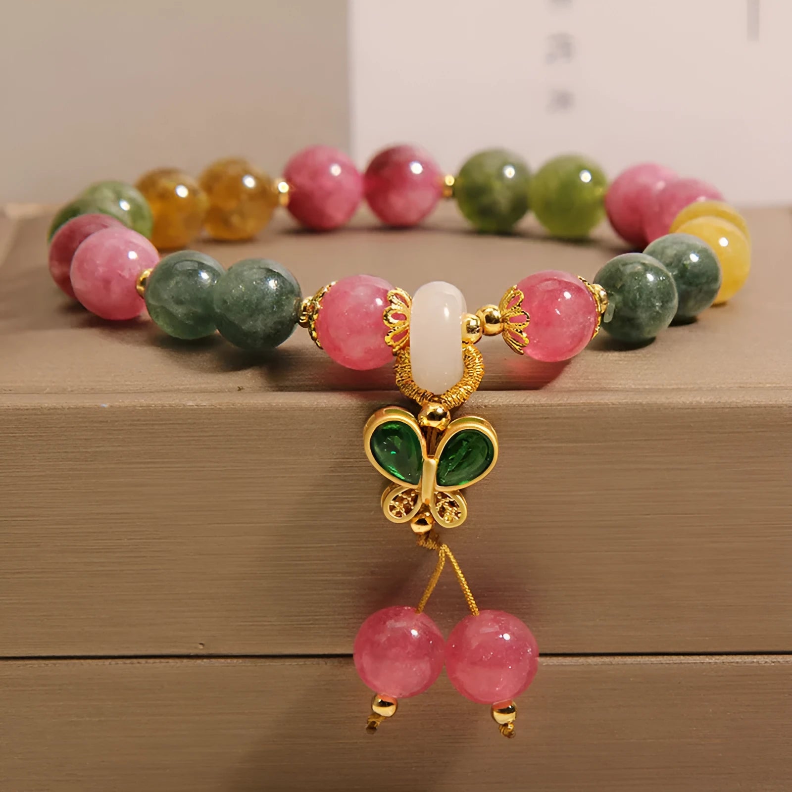 Butterfly pendant bracelet with colourful tourmaline gemstones in alloy setting and rhinestone accents