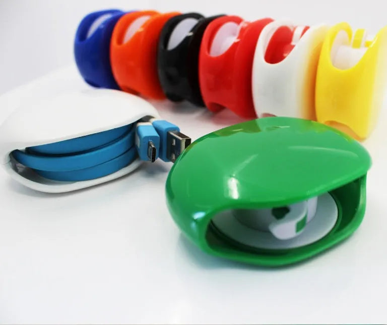 Automatic earphone cable winder showing white, blue, and black units with cable retracted into 72mm storage box.