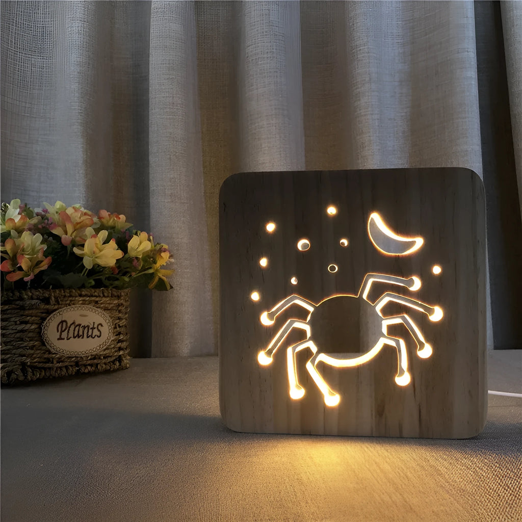 Halloween spider creative light made from pine wood with warm white glow on a wooden table
