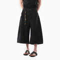 Men's black retro style cropped denim jeans with side pockets on a straight leg.