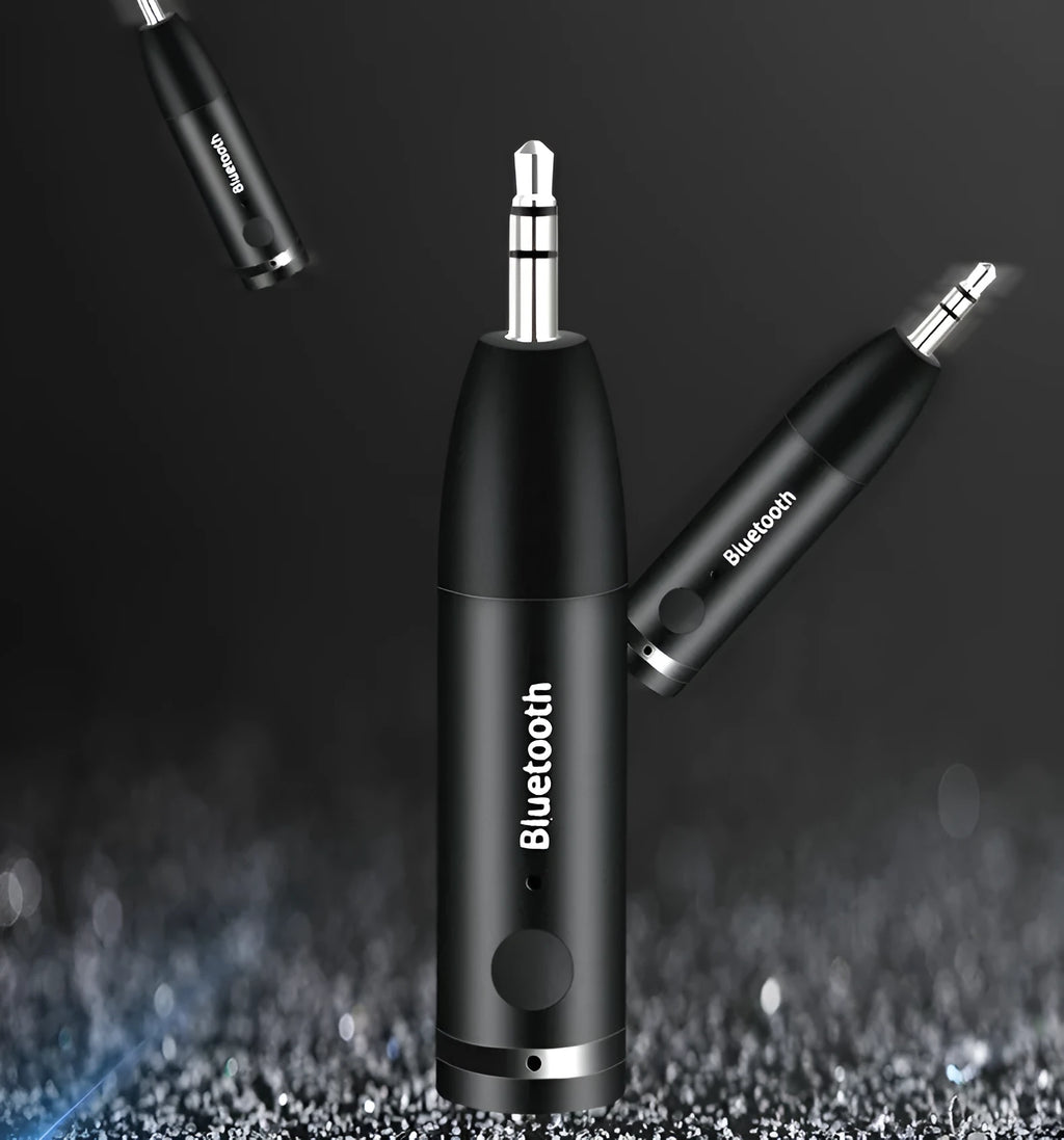 Black AUX Bluetooth 5.0 audio receiver for car or home stereo with USB cable.