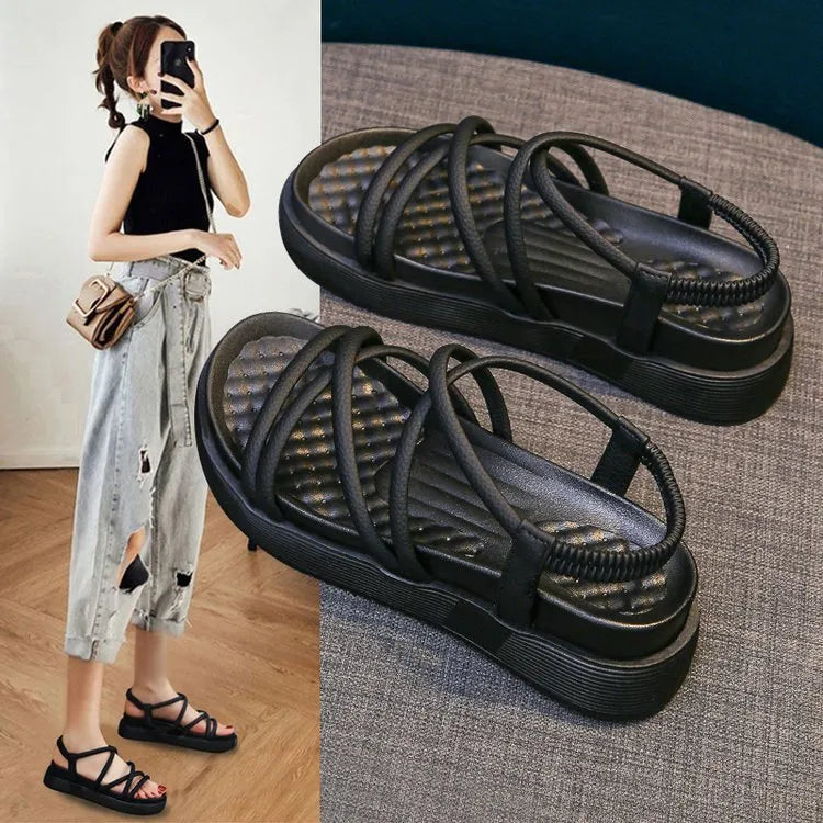 Women's black Roman style platform sandals with a round toe and sleeve design on a white background.
