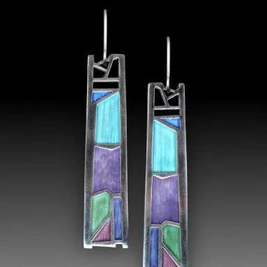 Silver coloured women's earrings with an irregular water drop shape made from alloy.