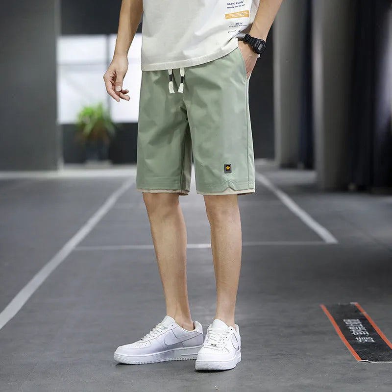 Man and woman modelling loose-fit casual beach shorts in South Korea style, available in multiple colours.