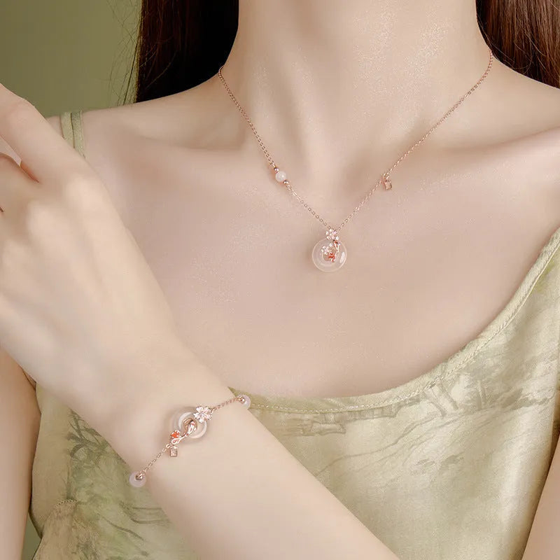 S925 sterling silver bracelet with Chinese flower design and white chalcedony crystal accents featuring koi fish motif