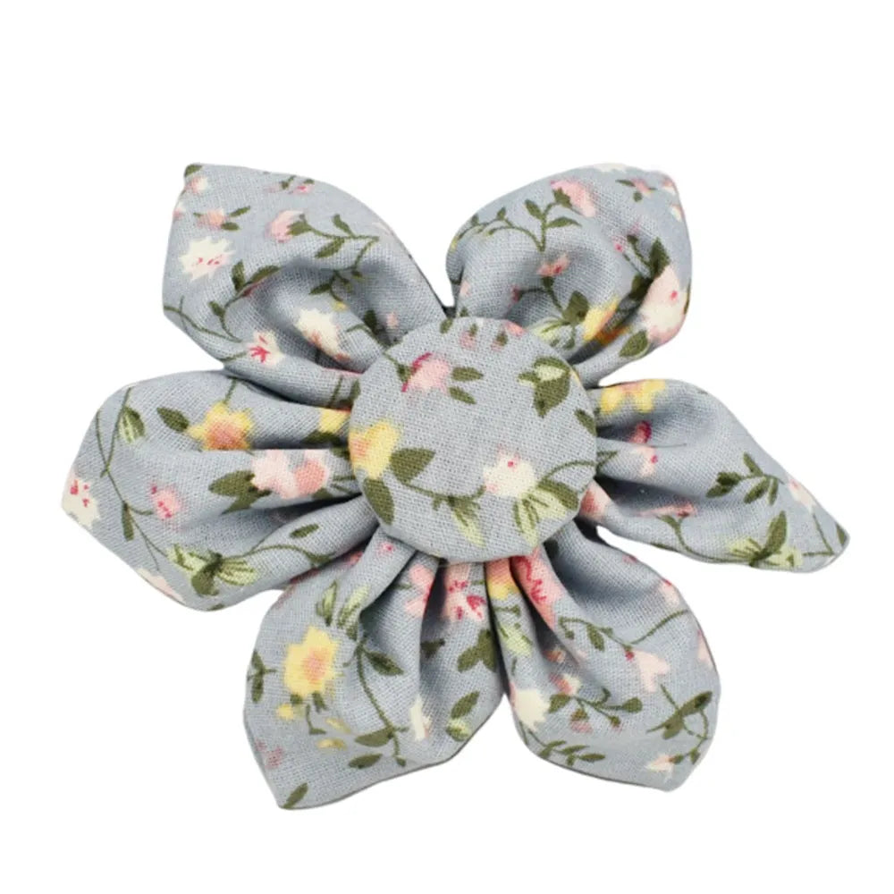 Floral print dog collar and leash set with matching bow, vest, and poop bag holder.
