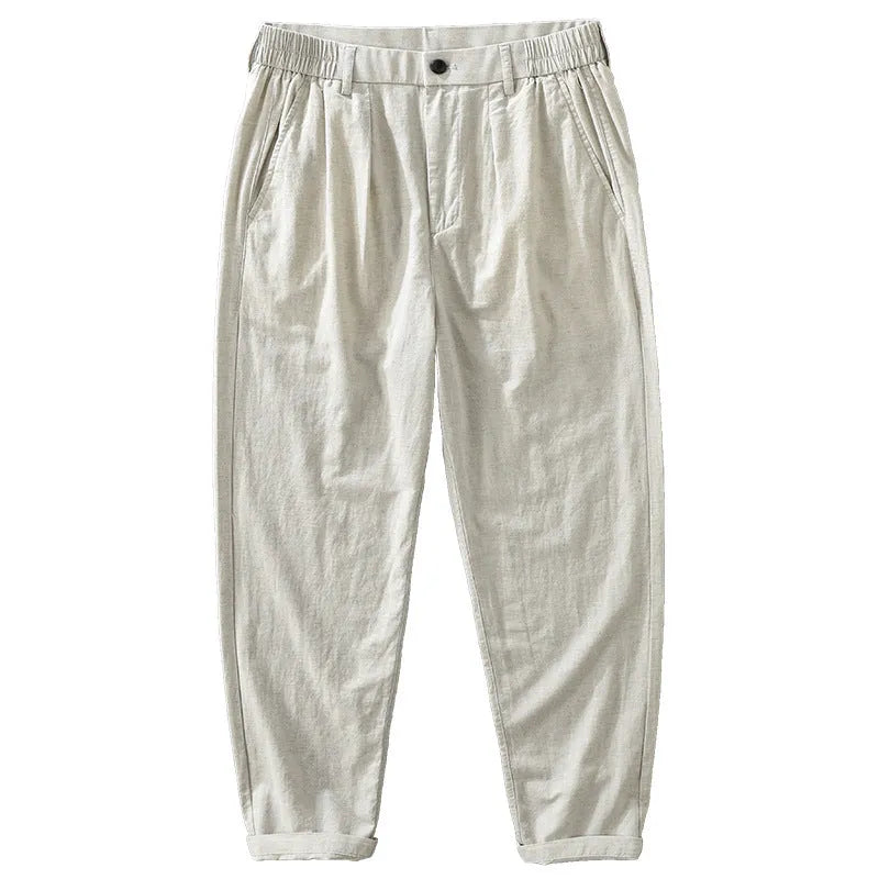 Man wearing loose straight-leg cotton linen blend trousers in a casual setting