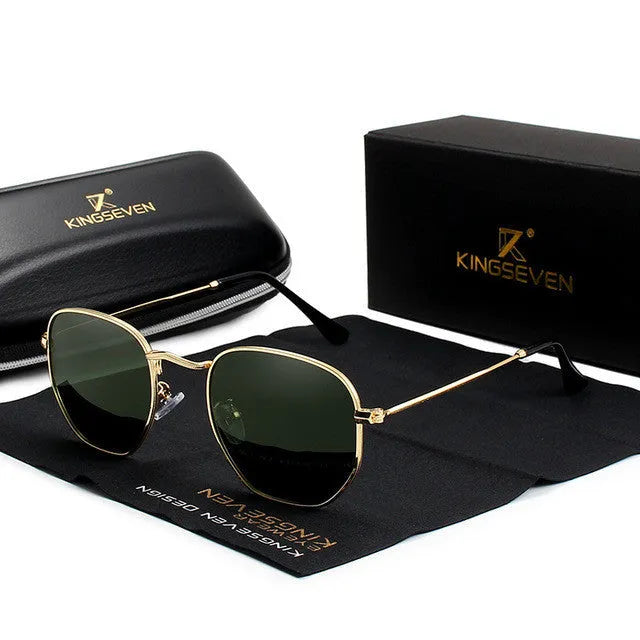 Classic round metal frame sunglasses for men in gun grey colour with UV400 lenses on a table.