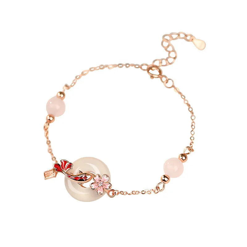 S925 sterling silver bracelet with Chinese flower design and white chalcedony crystal accents featuring koi fish motif