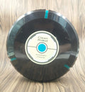 Black or white AC automatic sweeping robot vacuum cleaner on a hard floor.