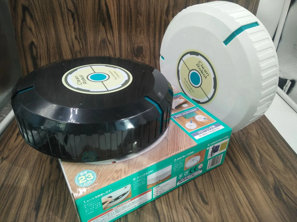 Black or white AC automatic sweeping robot vacuum cleaner on a hard floor.