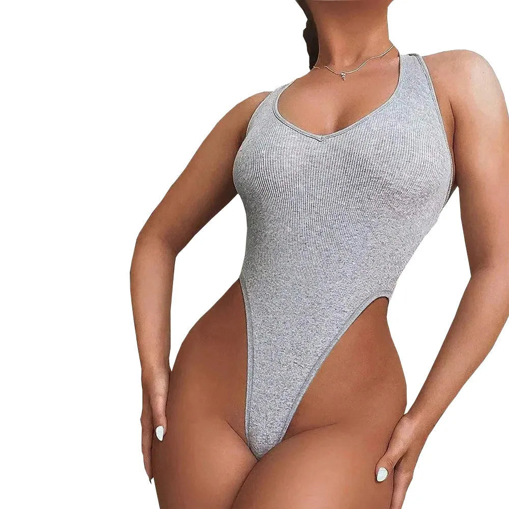 Grey women's halter neck jumpsuit with suspender straps and high-waisted shorts