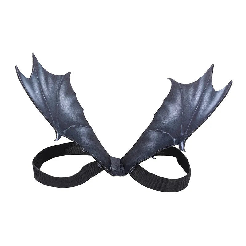 Black bat wing costume for a dog or cat on a Halloween background.