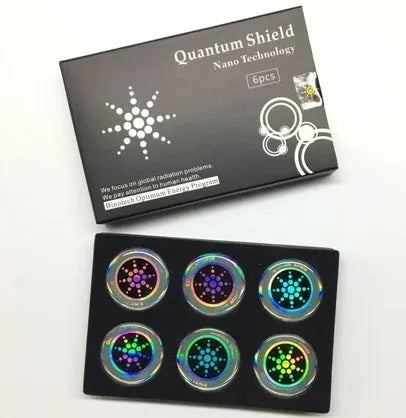 Six mobile phone anti-radiation stickers in silver and gold colours with self-adhesive backing