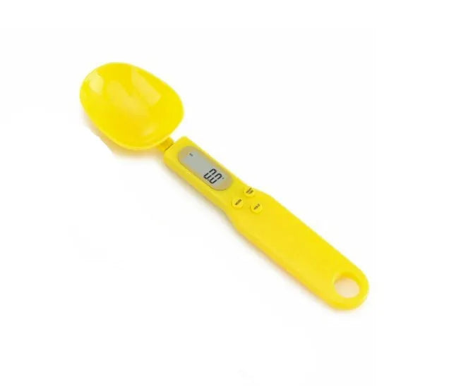 White digital kitchen spoon scale with LCD display showing weight measurement