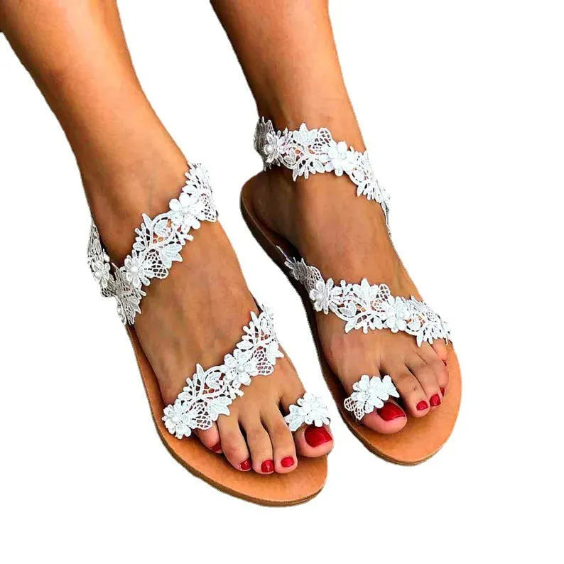 White women's flat shoes with rhinestone floral patterns and round toe design