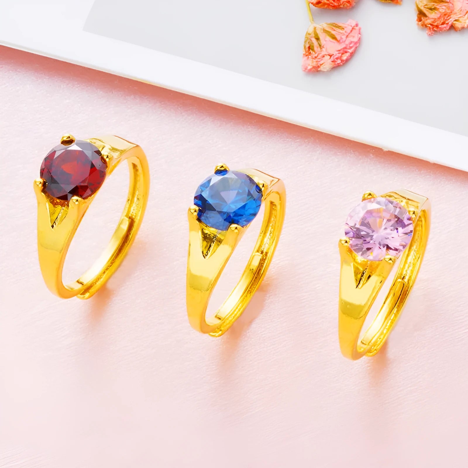 Adjustable Vietnam placer gold zircon ring for women in six colour options on a white background.