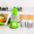 Rotary hand drum grater with stainless steel blades for julienning carrots and potatoes, available in blue, green, or red.