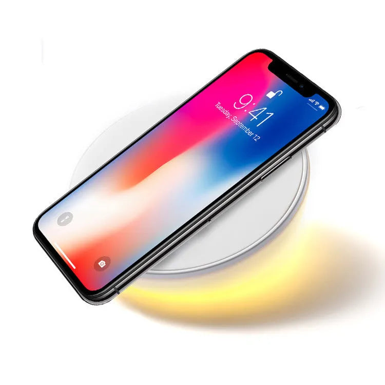White wireless charger with digital clock display, alarm buttons and night light function