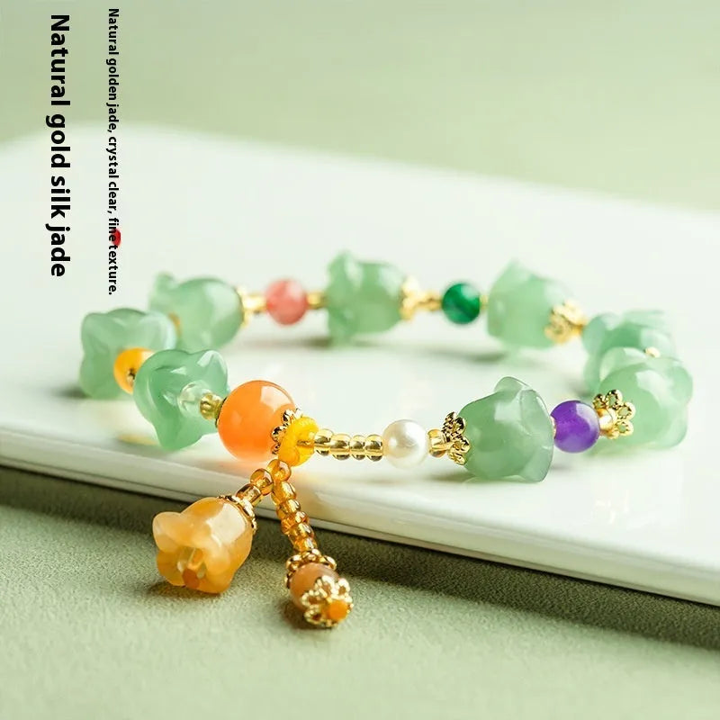 Women's natural jade orchid bracelet with carved beads for 14-18cm wrist.