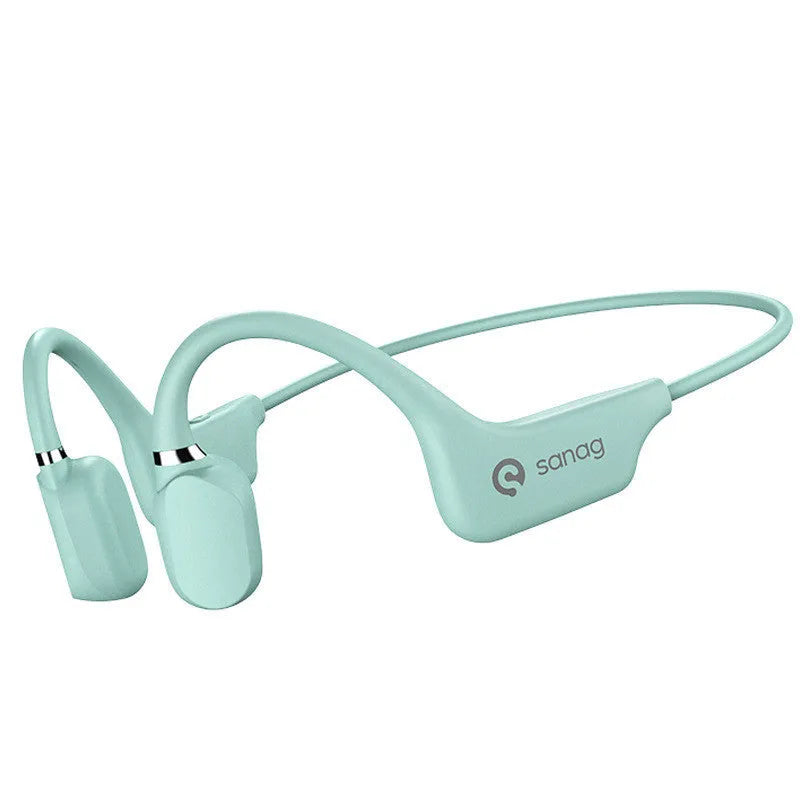 A person wearing black bone conduction Bluetooth headphones around their neck during a run.