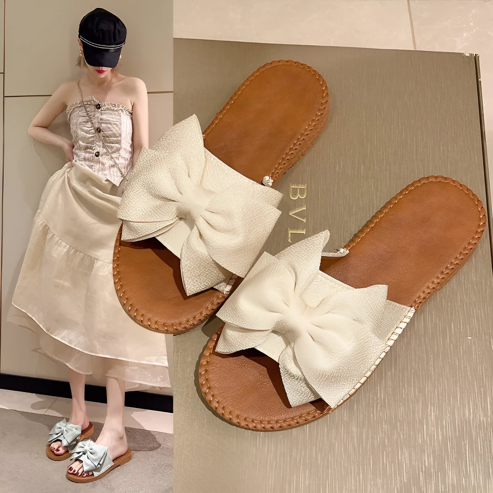 Women's beige suede slip-on sandals with a bow detail and soft rubber sole.