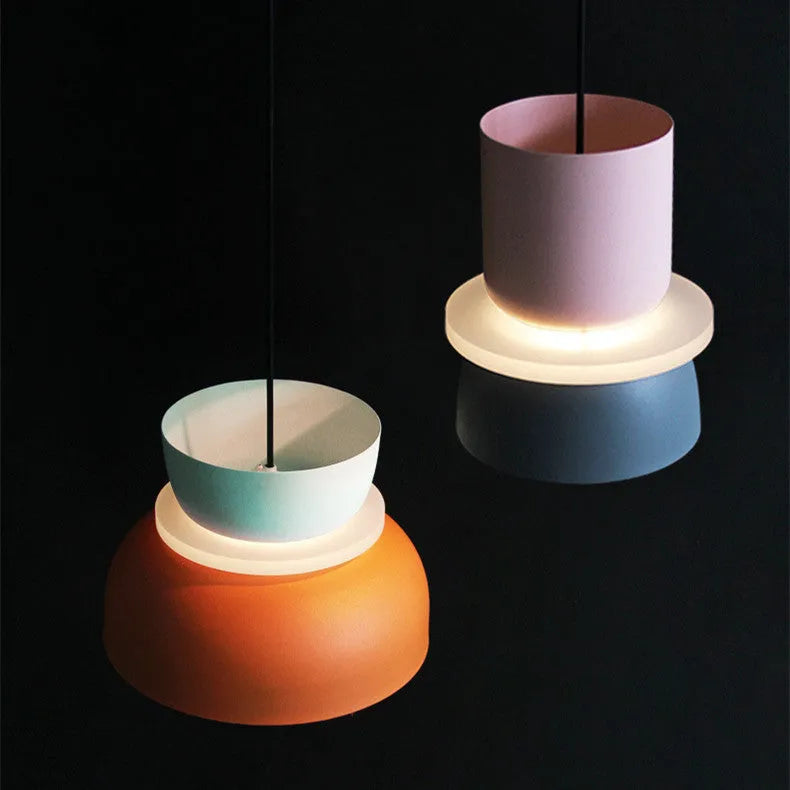 Nordic minimalist iron pendant light in a dark colour with a warm light bulb for bedroom or cafe use