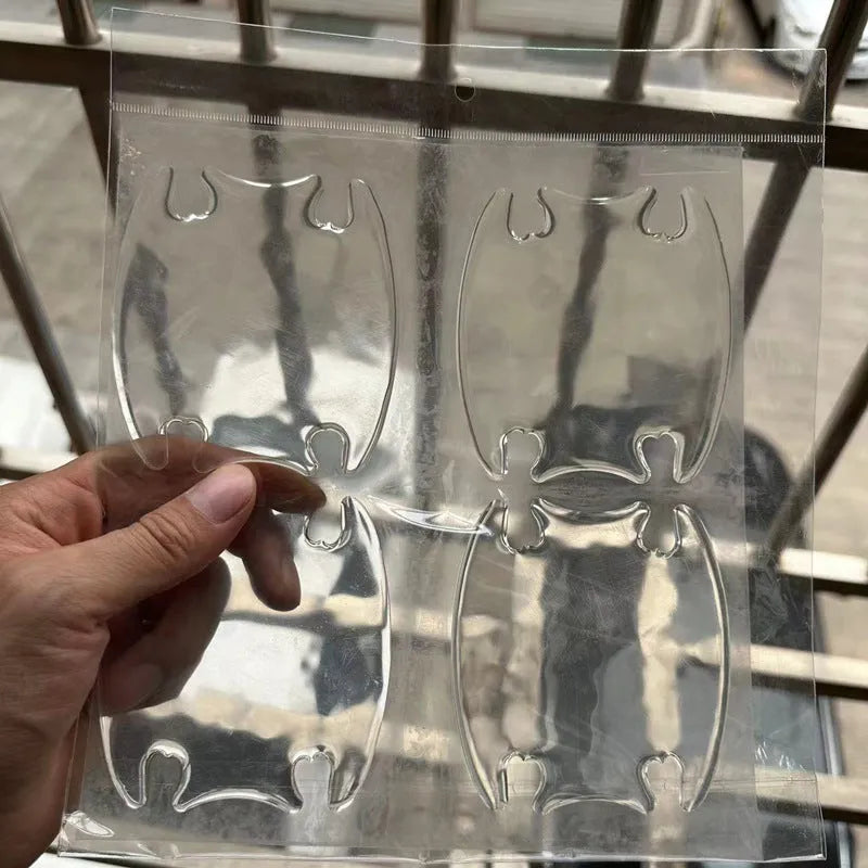 Transparent 3D car door handle protection stickers applied to vehicle door handles