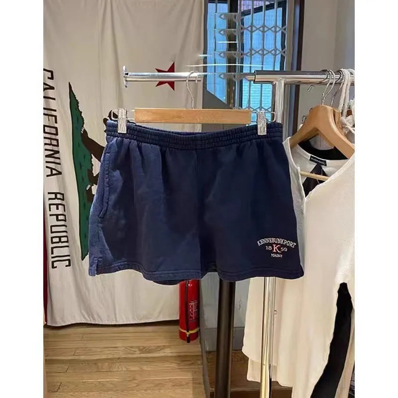 Women's cotton high top sports shorts with white flag embroidery in dark blue colour