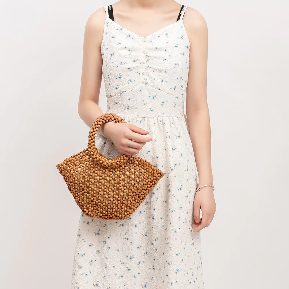 Hand-woven maple hollow handbag with wooden bead decoration, dumpling-shaped 13x7x18cm beach bag