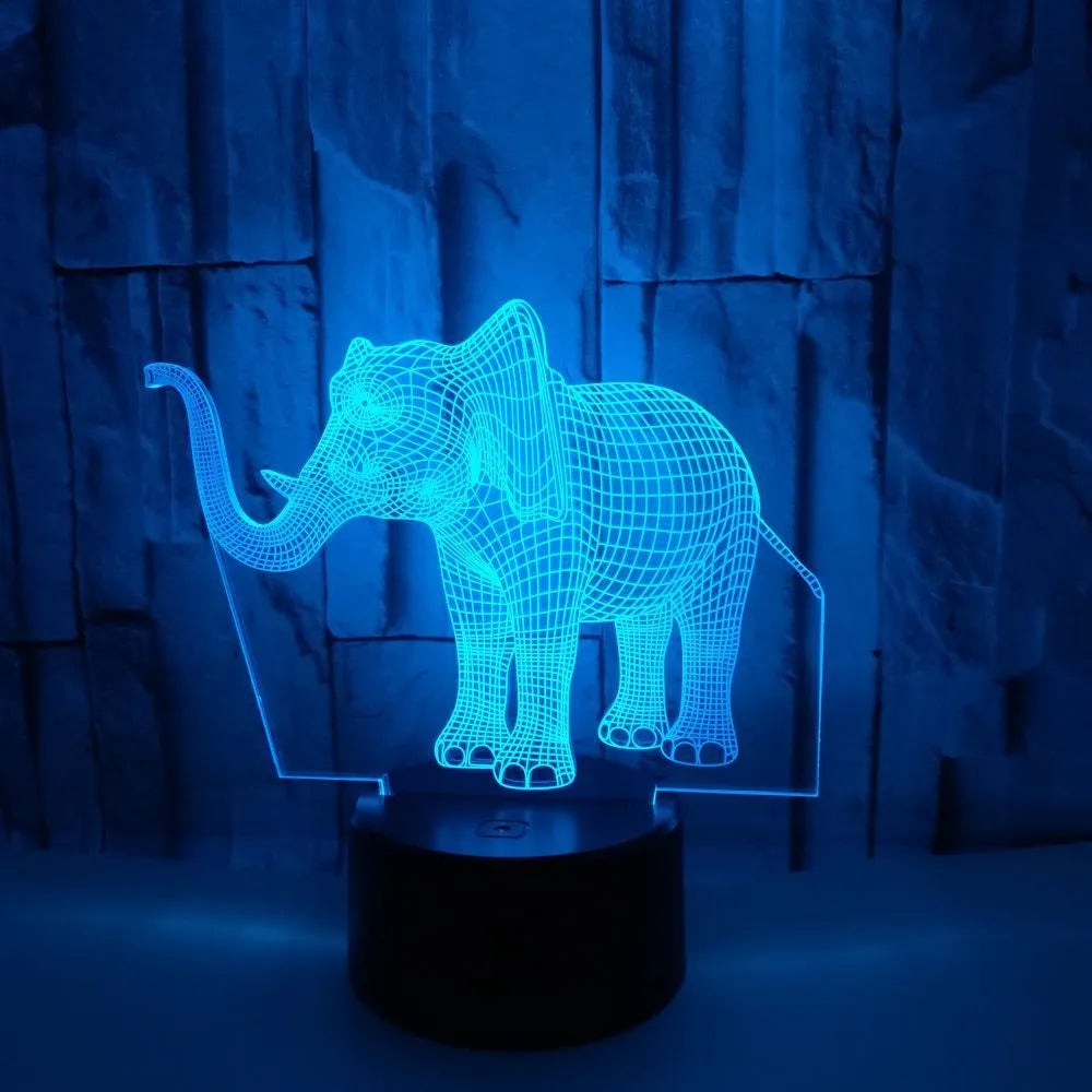 3D elephant-shaped acrylic desk lamp with seven colour modes, USB-powered, on a desk surface