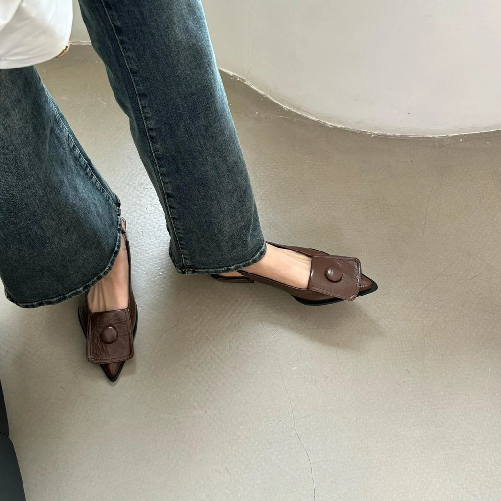 Women's low-heel closed toe sandals with a pointed toe and a back strap in apricot colour.
