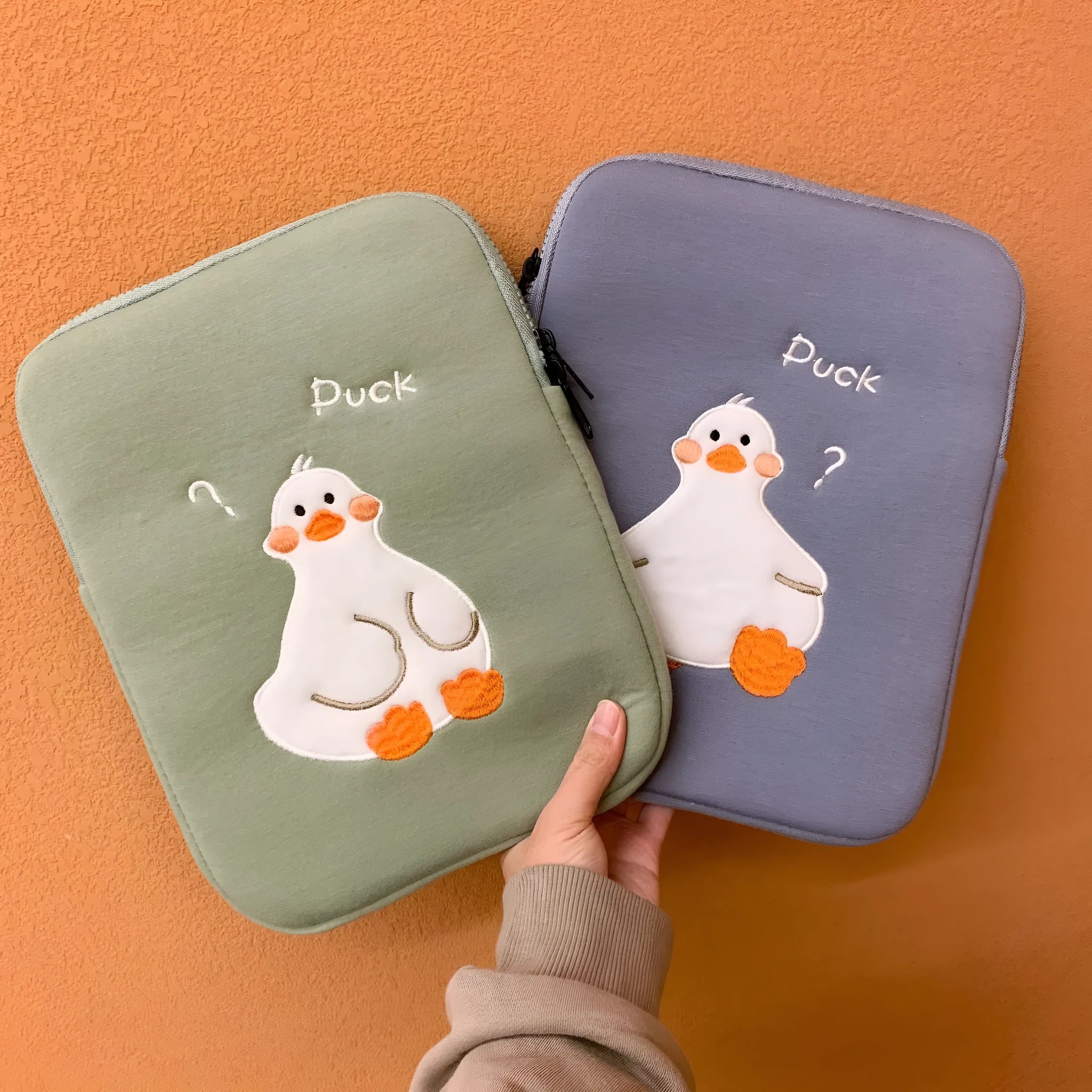 Blue cotton tablet case with duck embroidery, zipper closure, and 11inch to 15to16inch size options