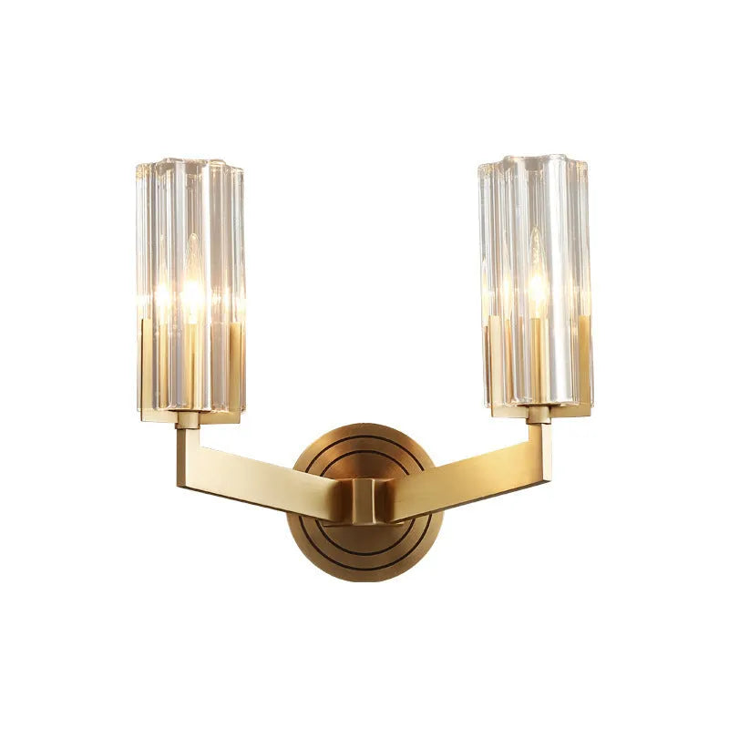 Modern minimalist copper wall lamp with single head on a white wall.