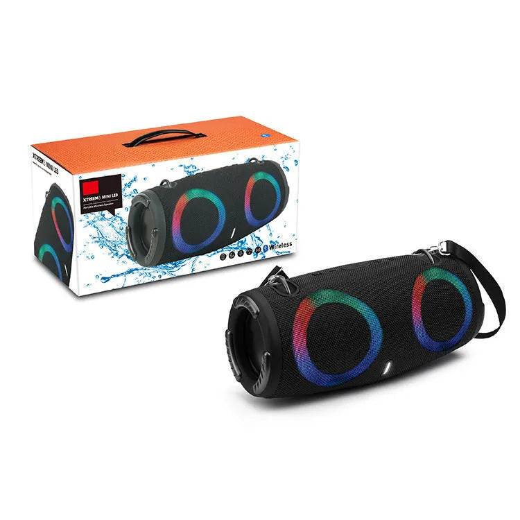 War Drum portable Bluetooth speaker in camouflage colour with dynamic RGB lights, showing carrying strap and control buttons.