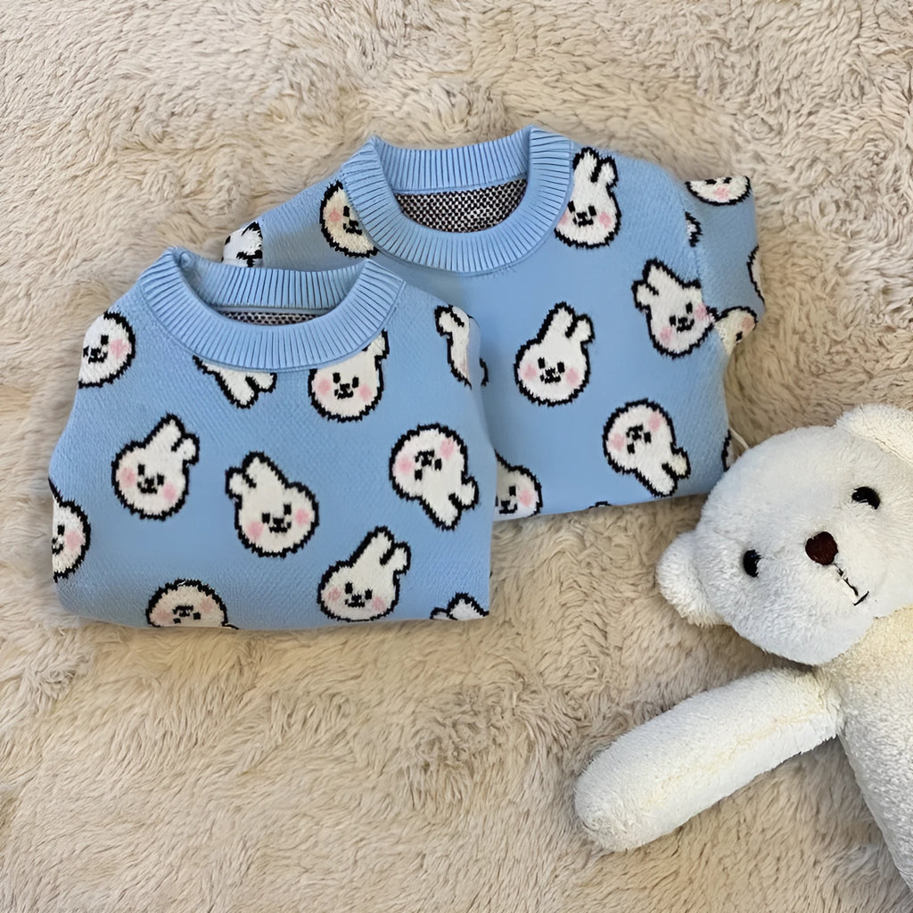 Small dog wearing a blue knitted winter sweater with a charming pattern, soft polyacrylic material