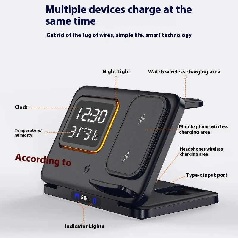 Black 5-in-1 wireless charging station displaying time and temperature, charging a phone and a smartwatch.