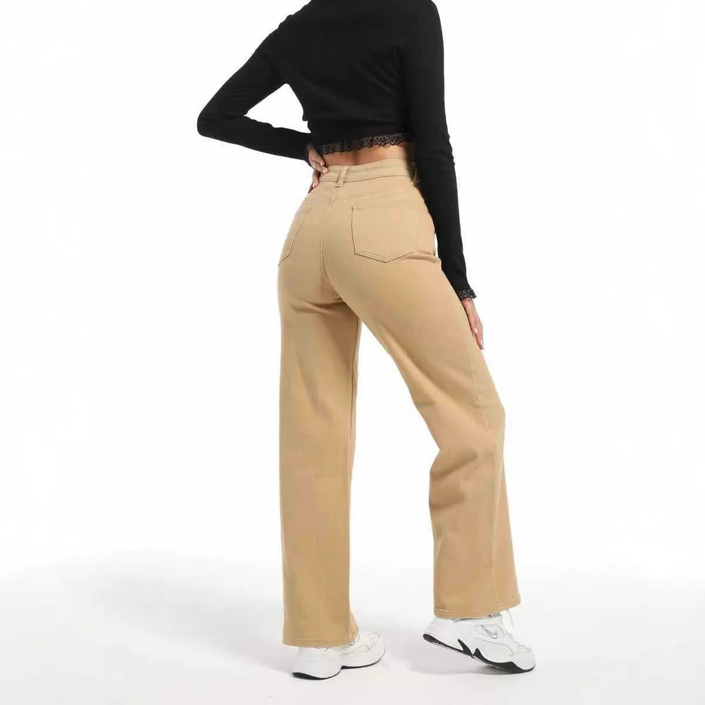 Women's apricot straight-leg wide trousers with a high waist on a hanger.