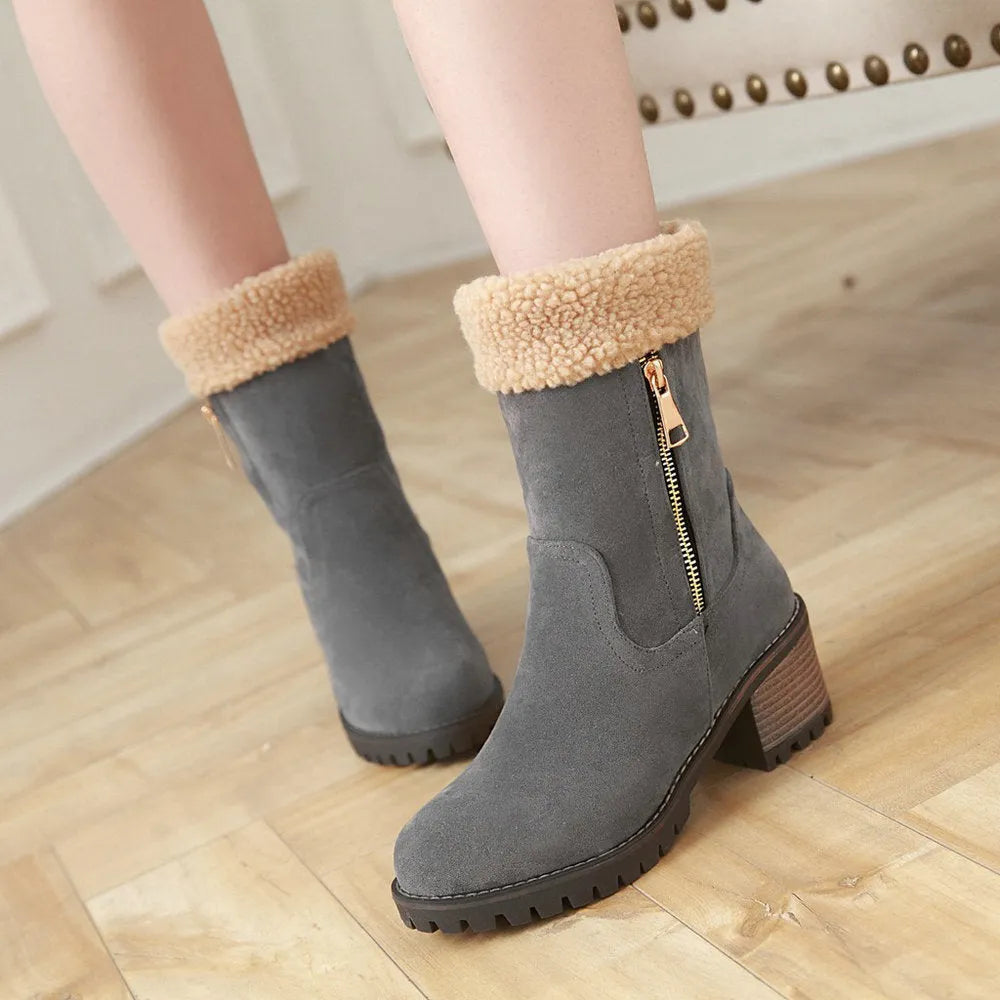 Men's black snow boot with thick rubber sole and warm lining, shown on a winter background.