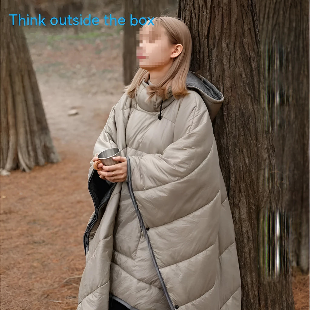 Outdoor cloak sleeping bag worn as cape showing grey colour and 200x140cm dimensions