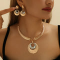 Gold alloy circle necklace and earrings set for women with celestial pattern options
