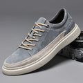 Men's grey and sand casual leather skate shoes with a round toe and rubber sole.