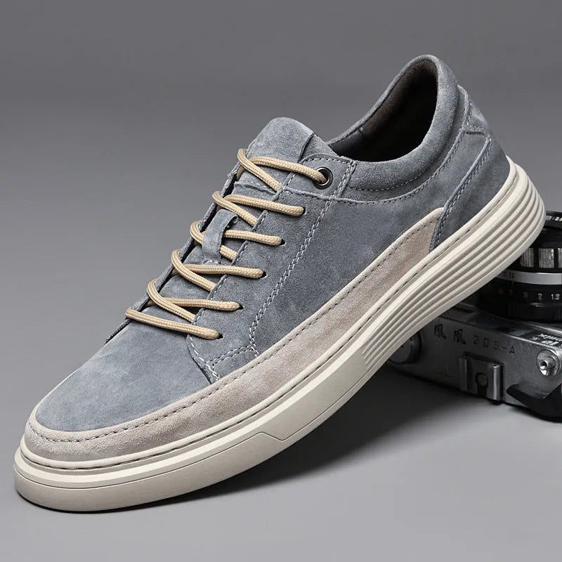 Men's grey and sand casual leather skate shoes with a round toe and rubber sole.