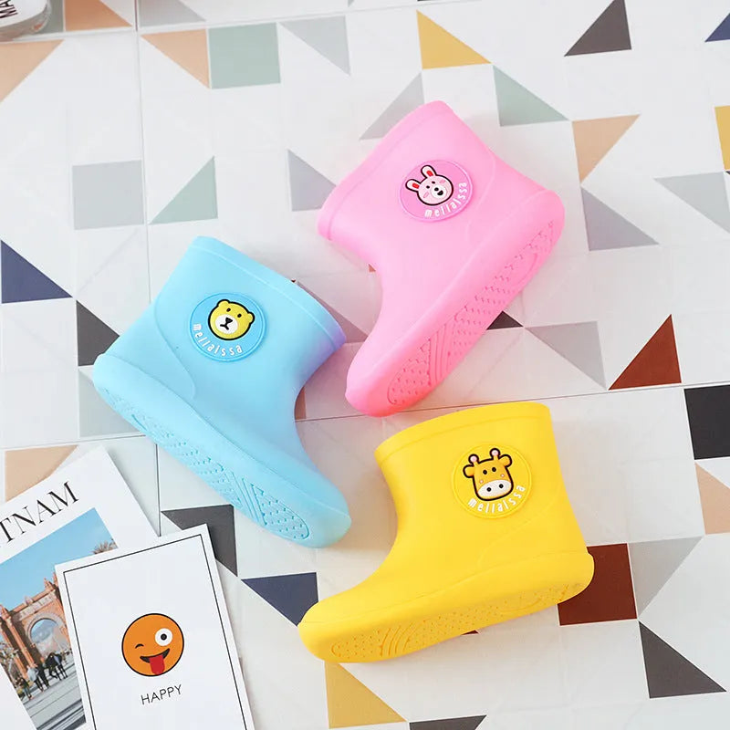 Children's short rain boots in yellow, pink, or blue with non-slip sole, waterproof PVC upper, cartoon pattern, sizes 14-18
