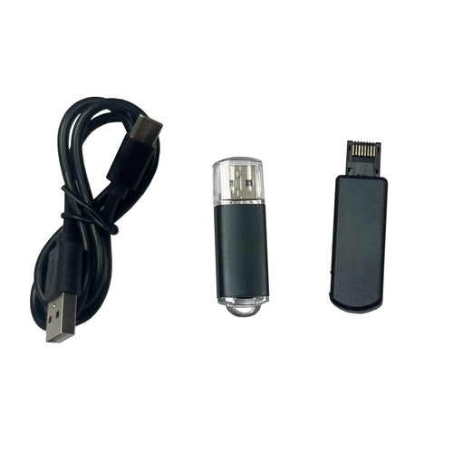 Black JB Tool USB adapter with Ethernet port for PlayStation consoles on a grey background.
