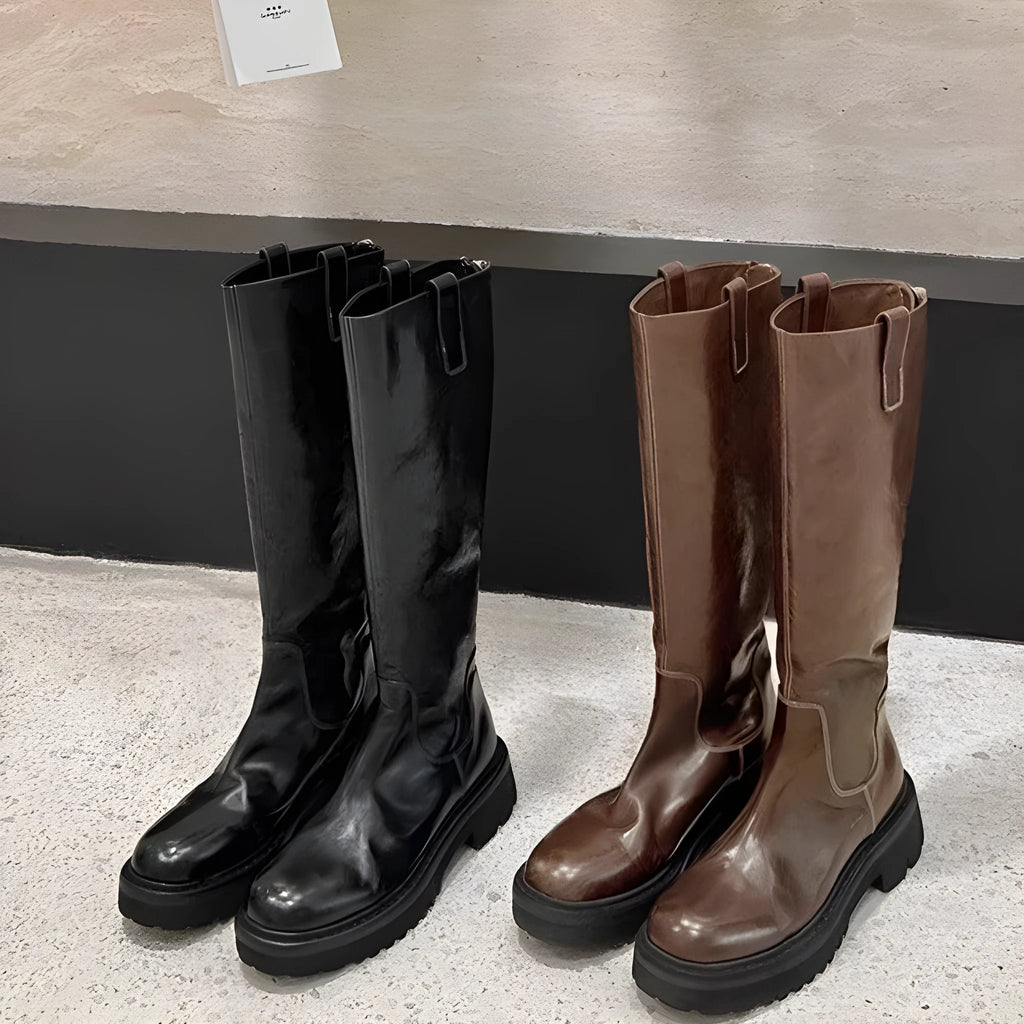 Women's black knee-high round toe boots with a chunky heel and back zipper on a white background.