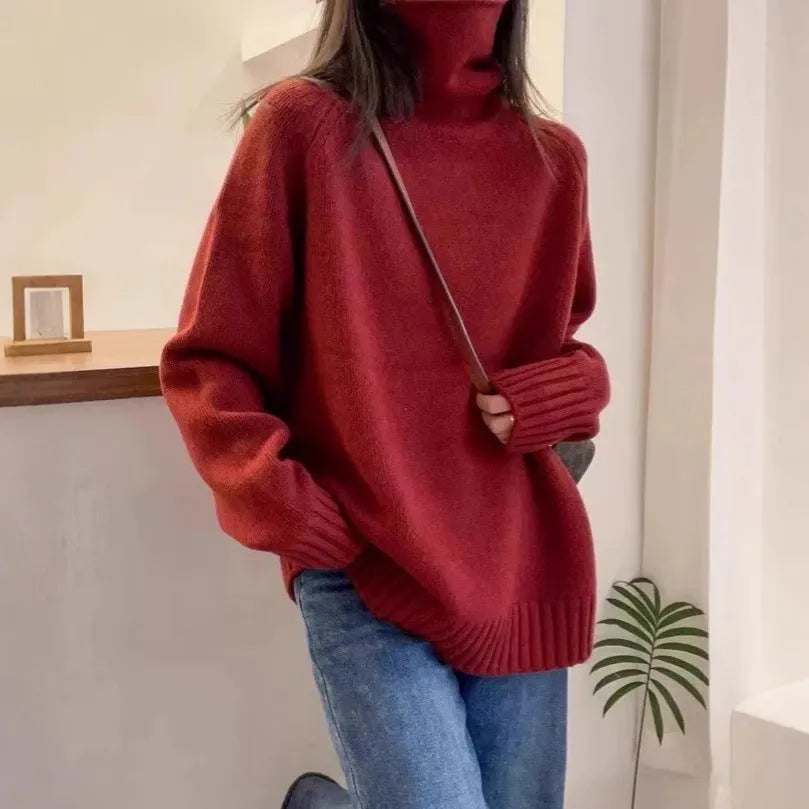 Women's loose fit black turtleneck sweater with a thick curling pile collar.