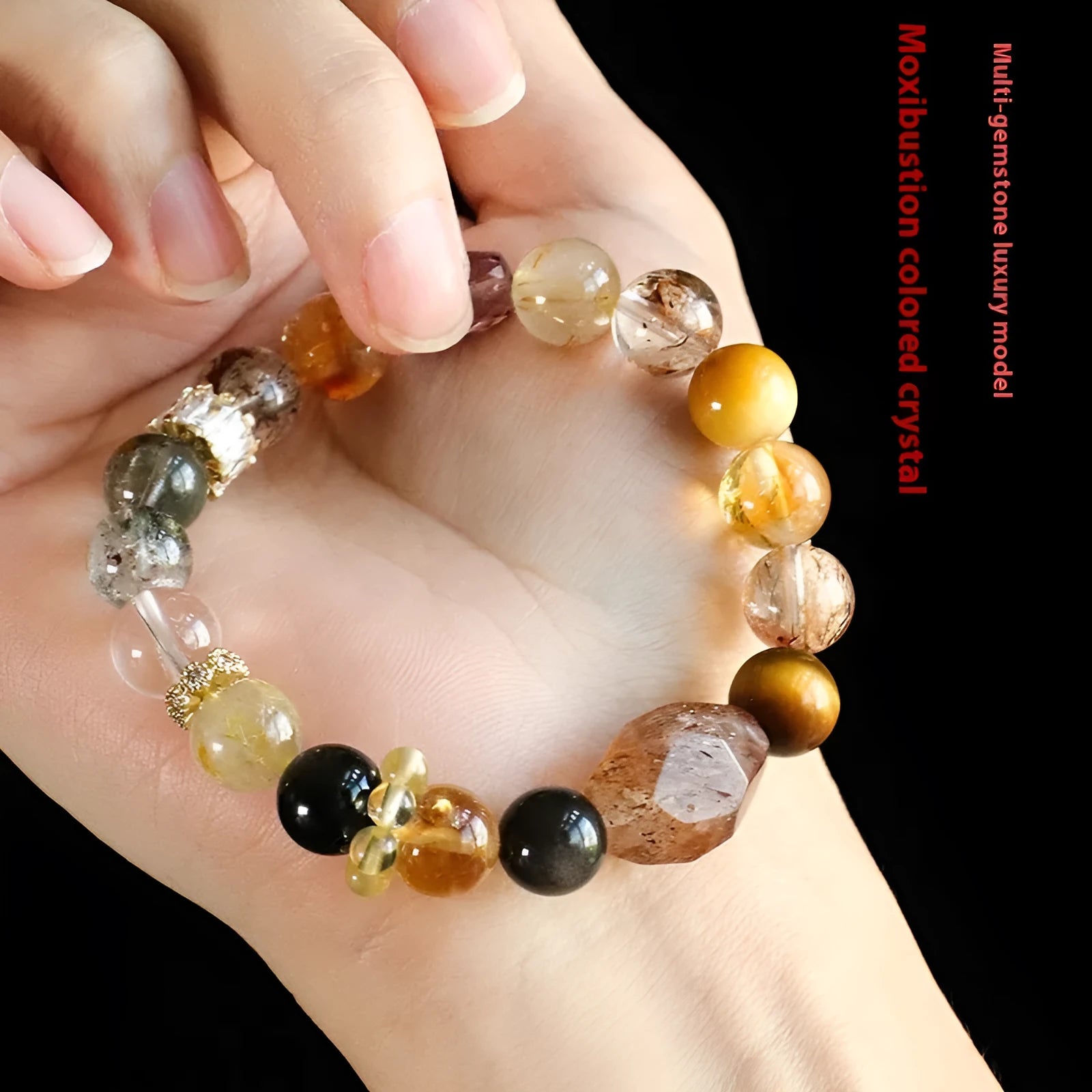 Close-up of a handmade black and gold natural crystal bead bracelet for women.